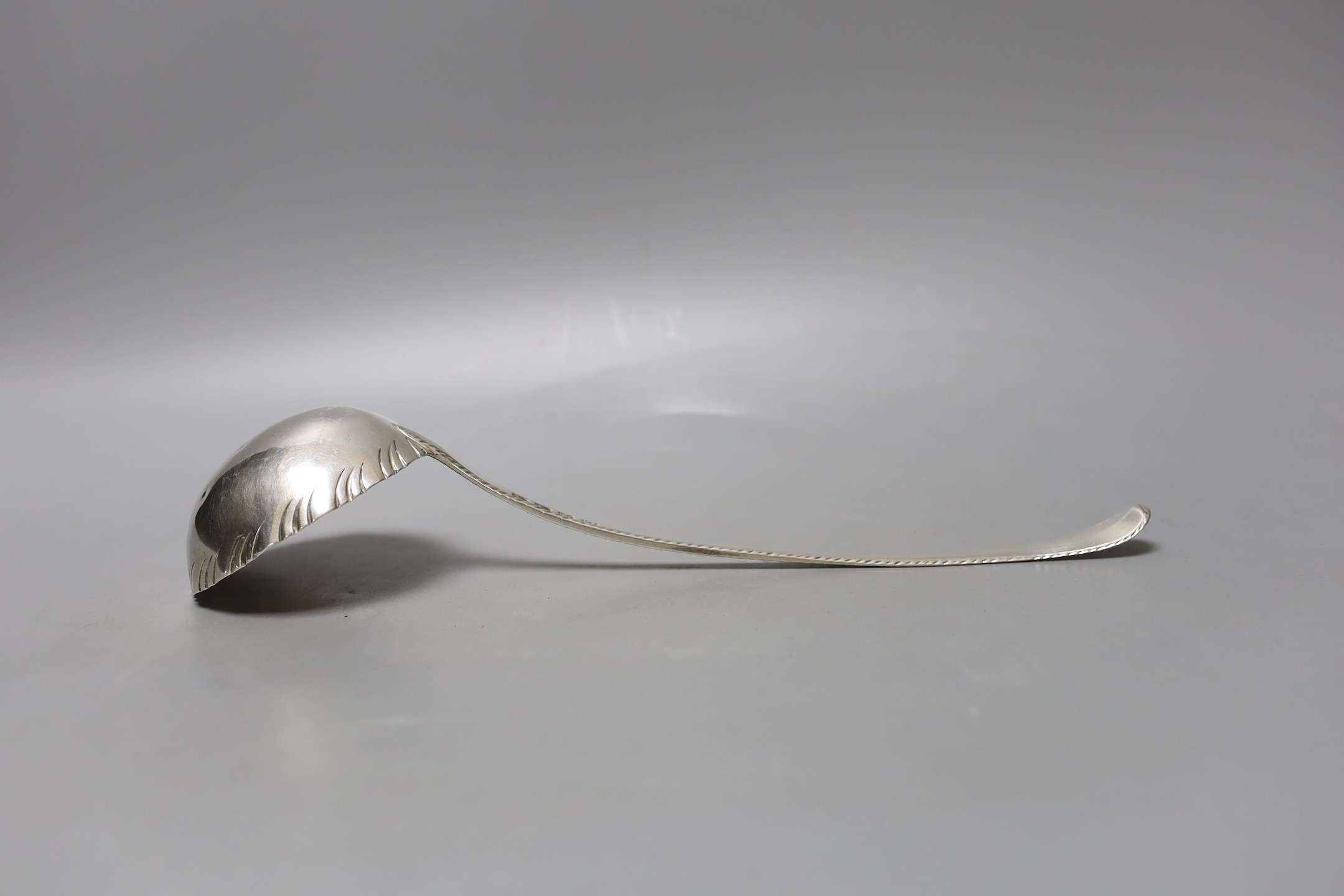 A George III silver Old English pattern feather edge soup ladle, John Lampfert, London, 1771, 32.2cm, 126 grams.